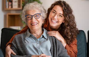 young woman smiling with older woman