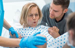 Daughter-in-law in delivery room giving birth