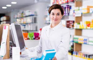 Walgreens worker at pharmacy register
