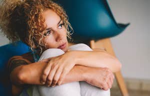 Woman reflecting on marriage while alone.