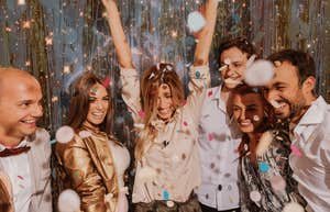 group of friends celebrating new year's eve resolutions successful astrology