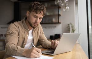 Husband writing a daily schedule for his wife