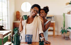 Mom Says Single Mothers Are ‘Robbed Of Motherhood’ single mom with her daughter drinking coffee in the kitchen