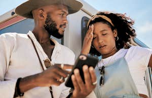 Odd Behaviors That Actually Mean A Man Is Stringing You Along With No Intention To Commit Frustrated woman next to man who is stringing her along.