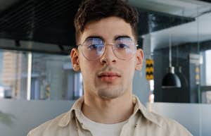 man wearing glasses looking serious