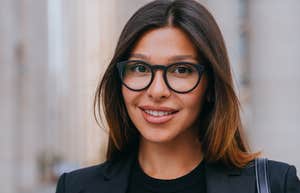 smiling happy businesswoman wearing black