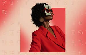 woman with money behind sunglasses zodiac signs attracting wealth december 26, 2024