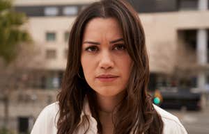 Woman staring seriously into the camera.