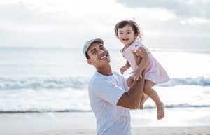 Dad and daughter at the beach for Dadurday tradition