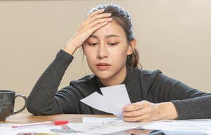 Woman, stressed, bills, money