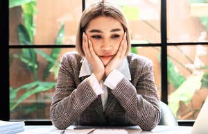 Miserable working woman debating on leaving job. 