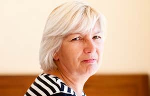 Adult Parent with a look of disapproval, expecting too much from grown child.