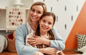 mom hugging resilient daughter