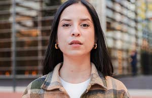 Confident young woman staring seriously into the camera.
