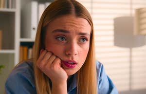 things people pretend to care about at work but absolutely do not woman pretending to care about something at work but she absolutely doesn't