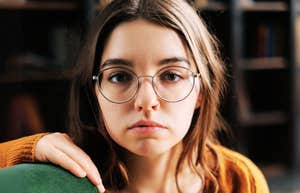 Young, serious woman who chronically attracts negativity