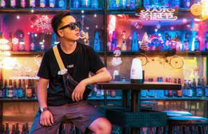 Man at a Japanese bar that uses wristbands to let customers know if you want to talk