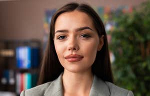 professional woman smiling slightly trying to find her purpose