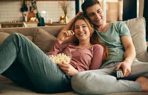 couple relaxing on couch at home