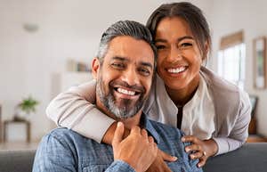 happy couple man making woman feel safe
