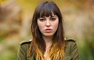woman pretending things are normal looking upset