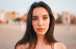 serious woman with long hair thinking about life lessons
