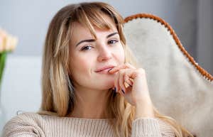 extremely smart woman thinking on a couch