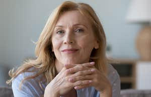older woman smiling after refusing to spend money