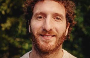smiling man not letting on his intelligence level