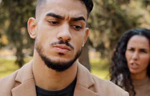 annoyed man embarrassed by wife in public