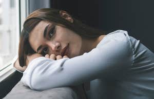 lone wolf woman sitting at home alone