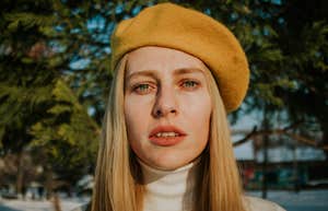 Things People Do In Public That Reveal How Unhappy They Really Are sad unhappy woman standing outside in beret