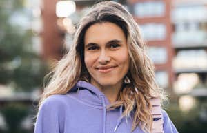 authentic young woman smiling outside