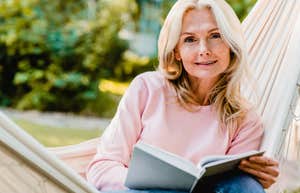 Comforting Reasons Trustworthy People Always Carry An Emotional Support Book With Them trustworthy woman reading a book in a hammock