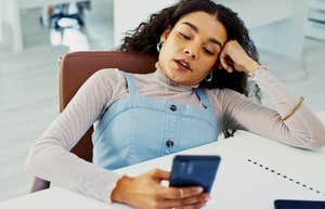 woman who hates talking on the phone looking at incoming call