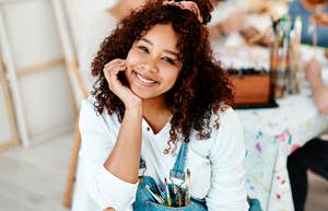 People Who Do This Nostalgic Little Activity Have Much Calmer Minds, According to Research  Woman doing a nostalgic activity to calm her mind.