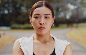 stern woman standing outside to exercise