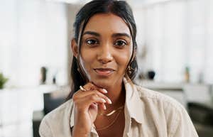 intelligent woman with genius energy thinking deeply at work