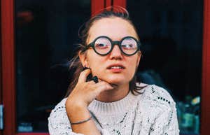 Socially aware person reacting awkwardly showing the phrases people with real social skills know are rude to say to someone single.