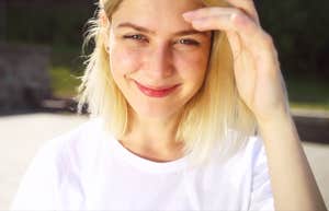 Woman smiling slightly coy showing why certain affirmations are shockingly effective even for skeptics