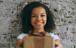 Daughter gives parents gift.