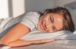 happy woman with common sense waking up for her morning routine