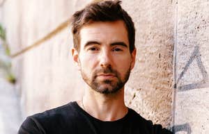 calm expressionless person giving an unreadable stare, capturing the subtle tells that expose people with sociopathic traits even when they blend in perfectly