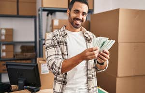 man holding up money