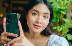 manipulative woman thinking of a text to send