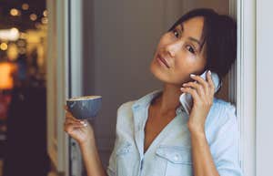 Woman who is never fooled by fake people holding tea in her home