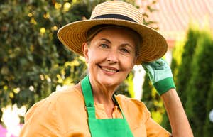 Gardening as a therapeutic hobby: A mature woman enjoying outdoor gardening, representing the simple, old-fashioned habits that contribute to better cardiovascular wellness