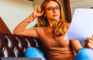 Gen X mom looking at her financial records