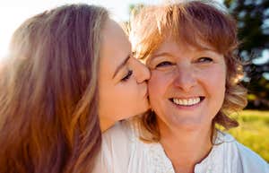 middle-aged mother who loved her daughter unconditionally embraced by her adult daughter