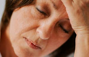 Woman experiences menopause symptoms.
